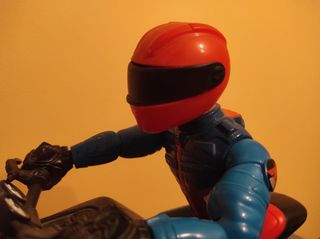 Moto de juguete con muñeco articulado