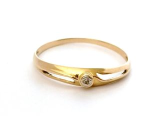 Solitario en oro de 18k y punta de diamante
