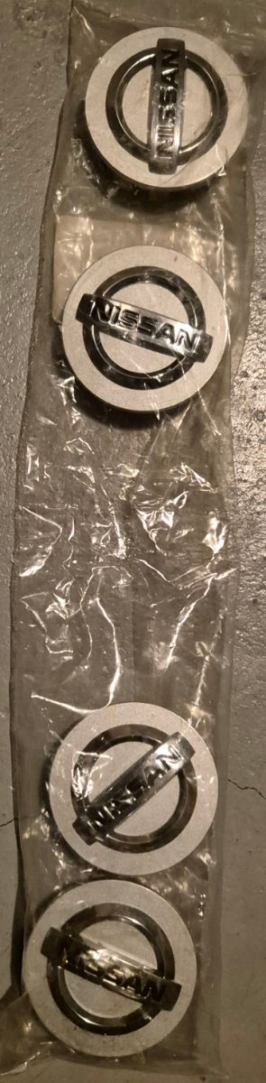 Tapa Llanta, cubre Buge Nissan