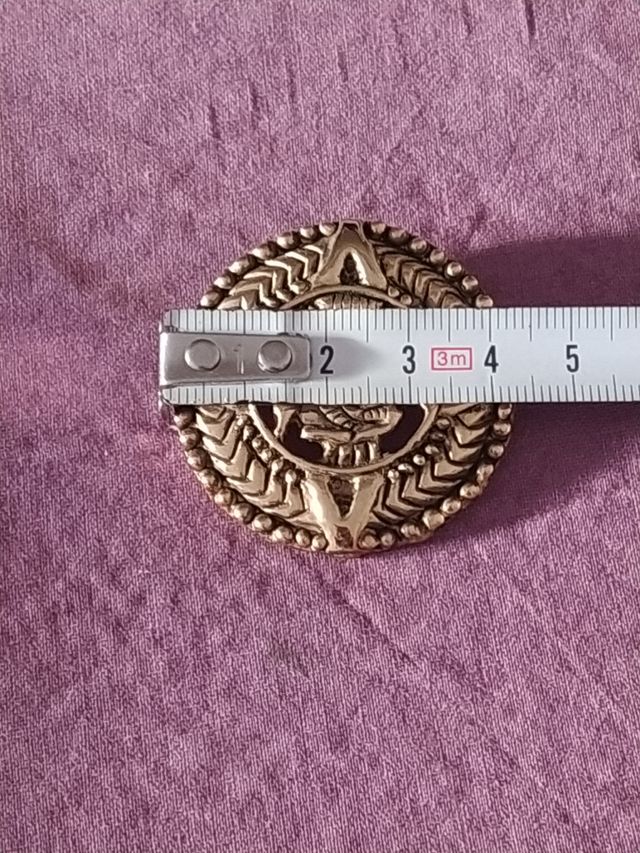 Broche étnico años 90