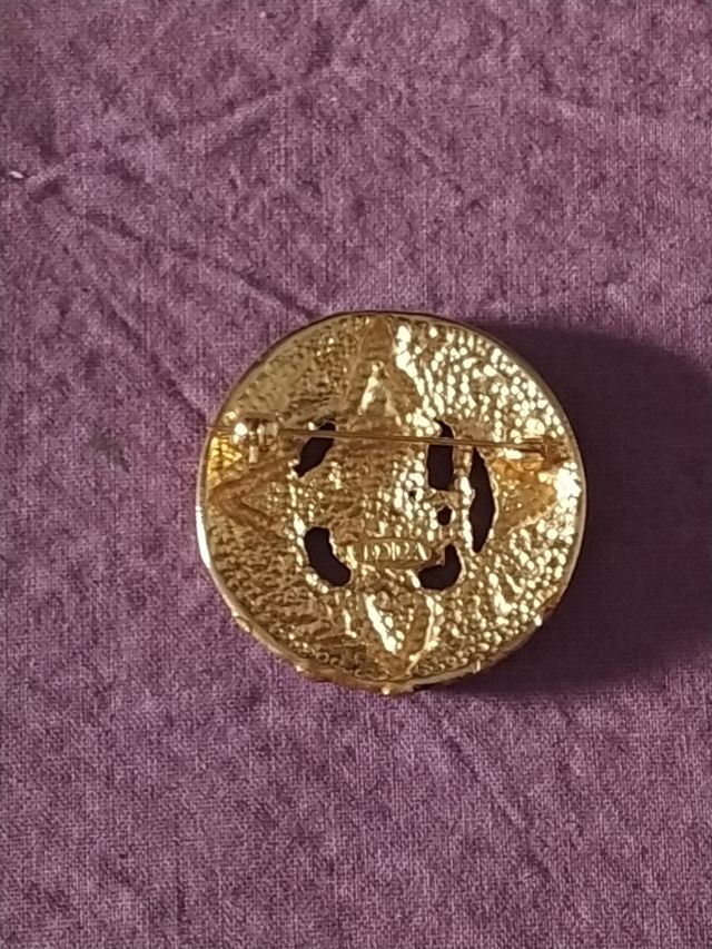 Broche étnico años 90