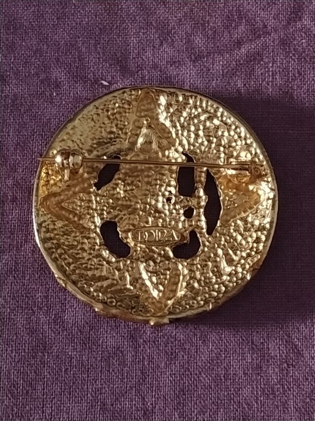 Broche étnico años 90