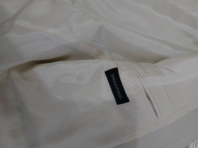 Americana. Bajo más de precio