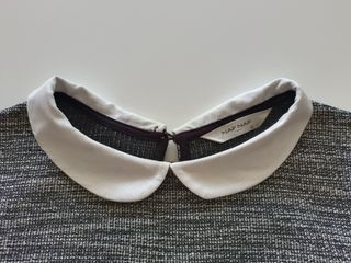 Jersey gris con cuello de Naf Naf.