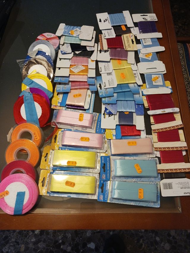 49 rollos cinta lazo textil.