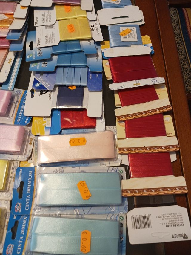 49 rollos cinta lazo textil.