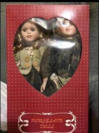 Coppia di bambole in porcellana biscuit