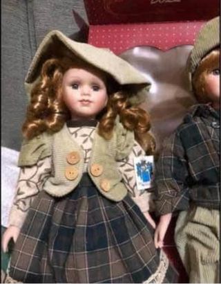 Coppia di bambole in porcellana biscuit