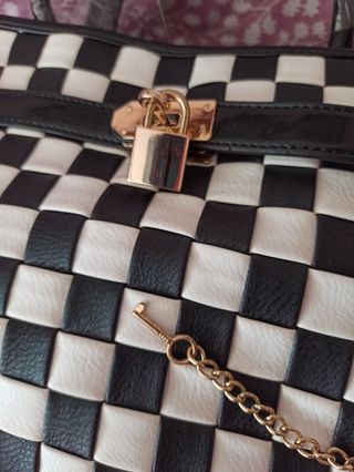 Bolso y cinturón Cristian Lay