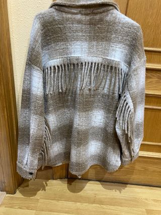 Chaqueta flecos