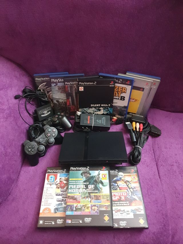 PlayStation 2 Slim + Juegos y accesorios.