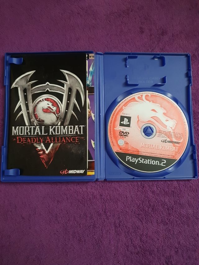 PlayStation 2 Slim + Juegos y accesorios.