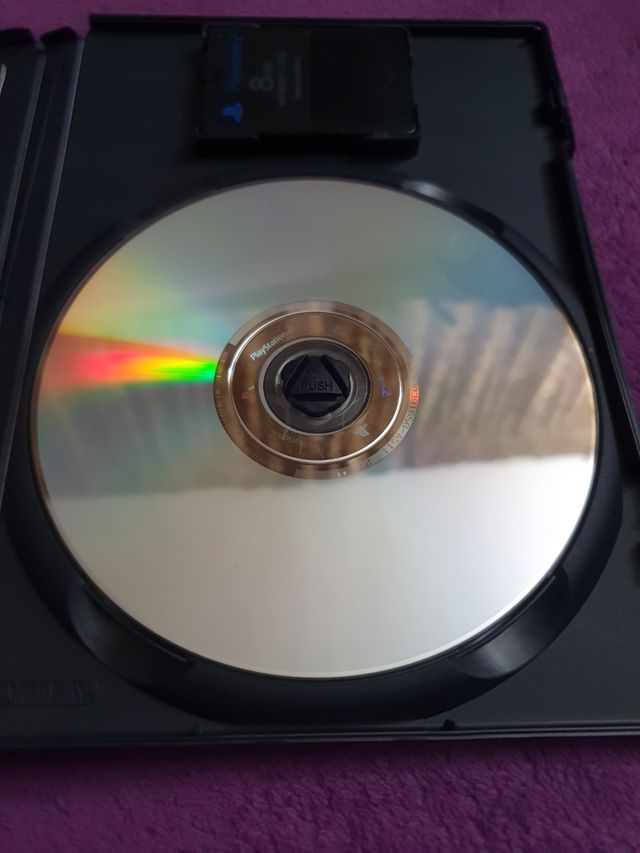 PlayStation 2 Slim + Juegos y accesorios.