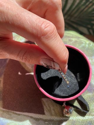 colgante de plata Tous grabado con la marca