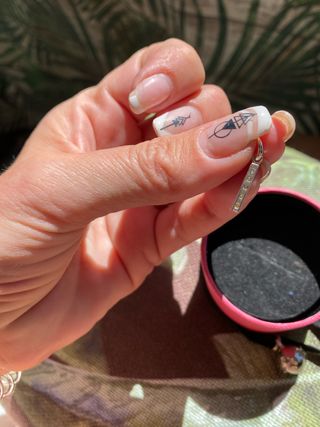 colgante de plata Tous grabado con la marca