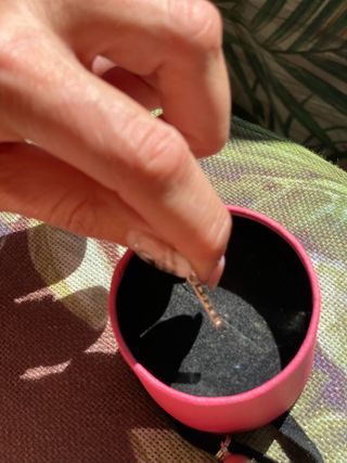 colgante de plata Tous grabado con la marca