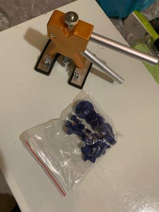 Strumento per rimozione ammaccature carrozzeria