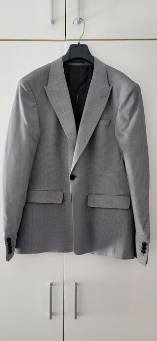 Traje nuevo de tachos