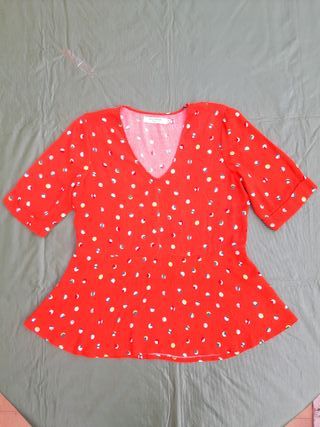 Blusa naranja con lunares