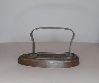 Plancha antigua de hierro fundido.