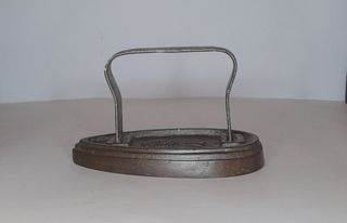 Plancha antigua de hierro fundido.