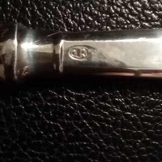 Apribottiglie in argento vintage. 