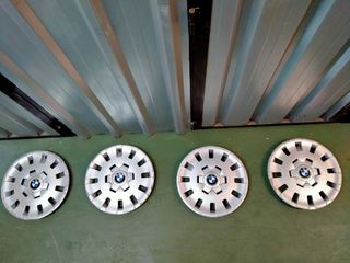 Juego tapacubos BMW.