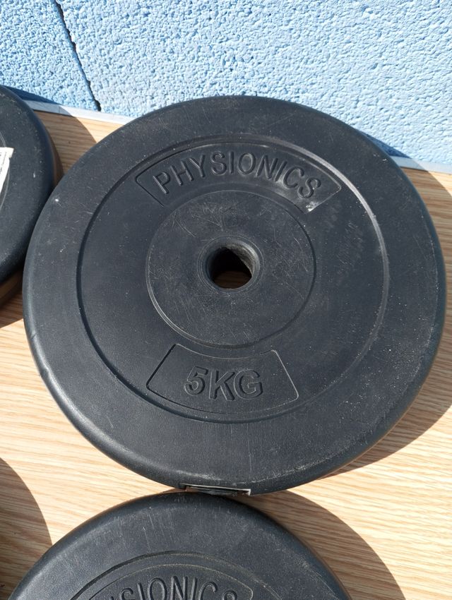 Juego de discos de pesas de plástico.