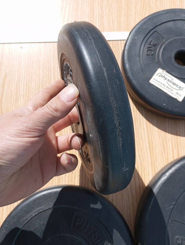 Juego de discos de pesas de plástico.