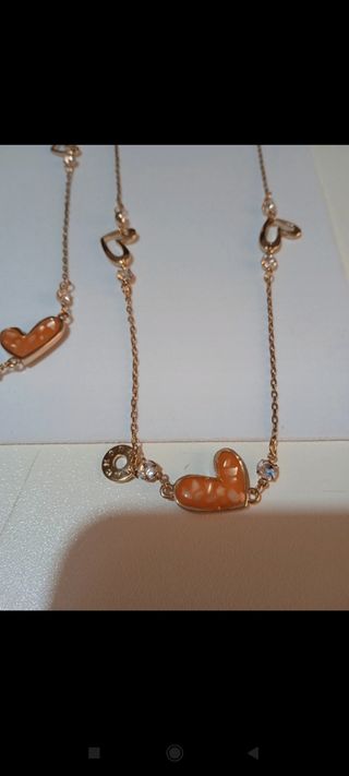 Collana lunga colore oro con cuori smaltati donna