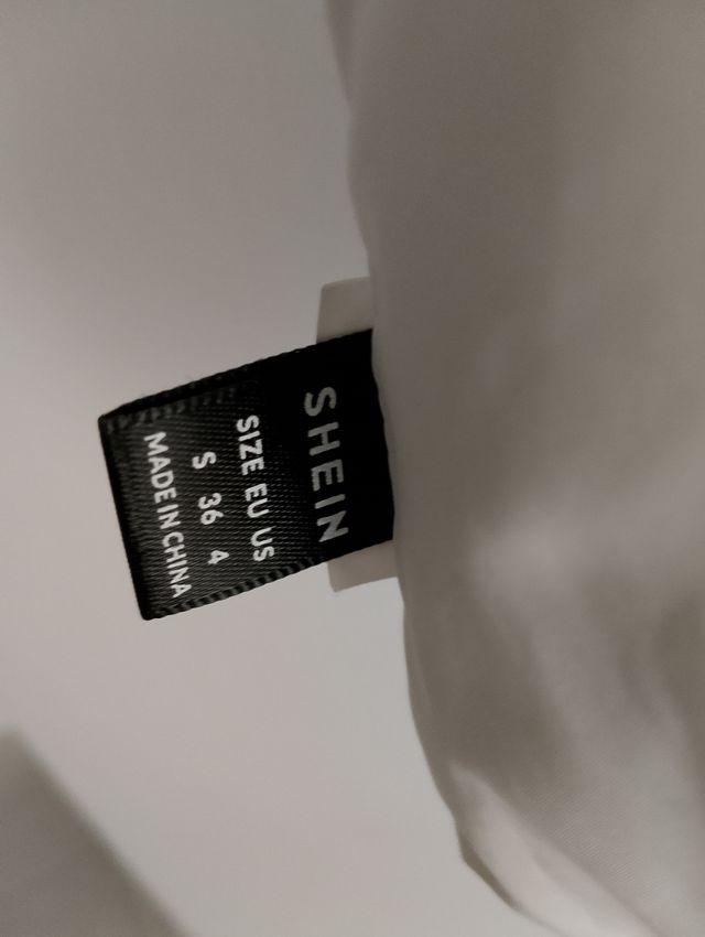 Piumino smanicato corto donna