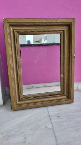 Pareja de espejos en dorado