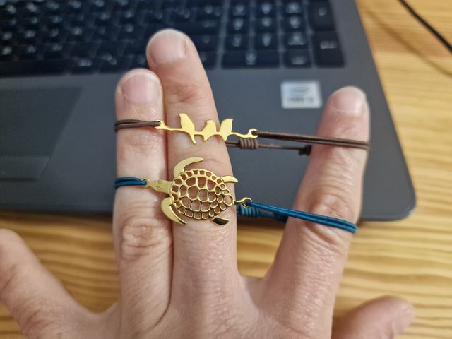 Pulseras goma tortuga y pájaros dorado