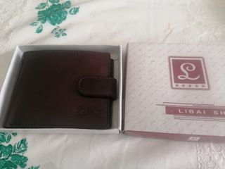 Cartera mano hombre