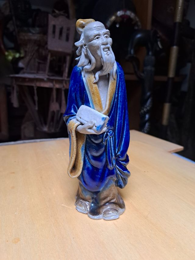 Statuina uomo di fango. Cinese