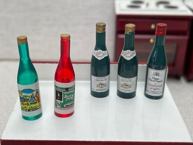 Lote botellas casa de muñecas