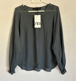 Blusa gris de manga larga