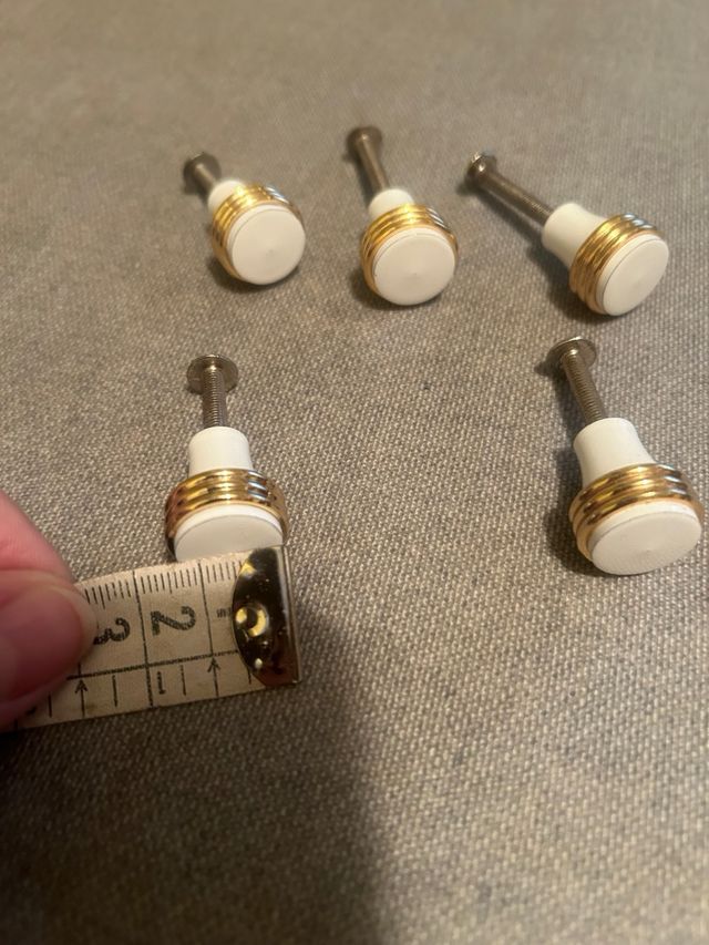 10 Pomos blancos/dorados