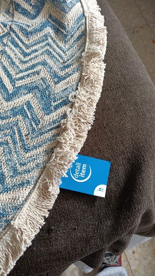 Alfombra nueva, con su etiqueta.