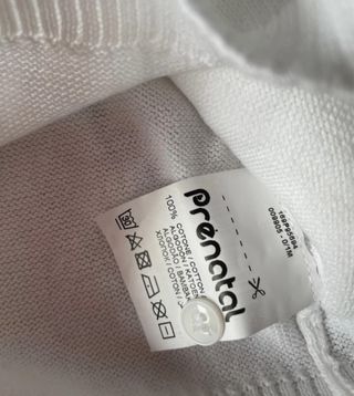 Maglioncino bianco di cotone con bottoncini