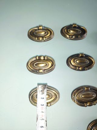 Conjunto 15 antiguos tiradores bronce repujado