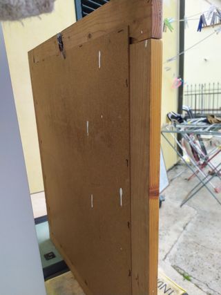 Specchio con bordatura in legno