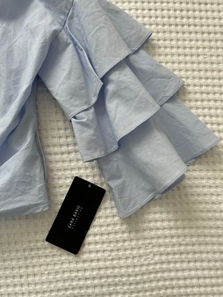 Blusa cruzada cropped con lazo de ZARA