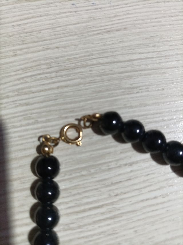 Collana in pietra nera e oro