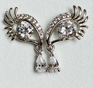 Pendientes surrealistas de ojos en plata ley 925