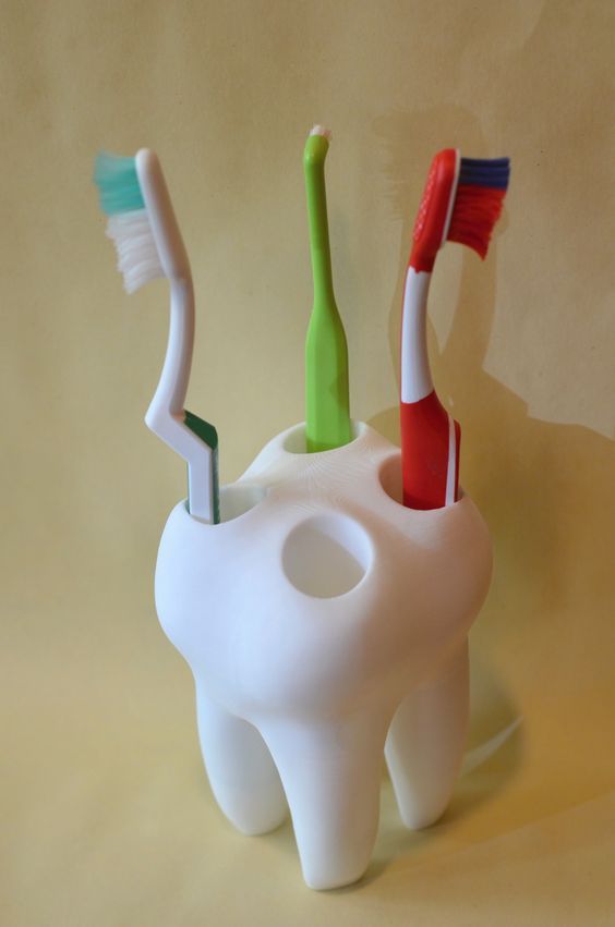 SOPORTE PARA CEPILLOS CON FORMA DE DIENTE