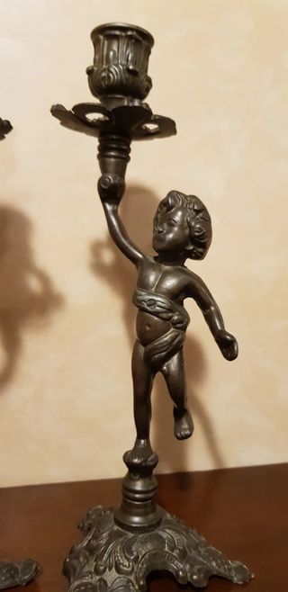 Coppia candelieri, portacandele con putti, metallo