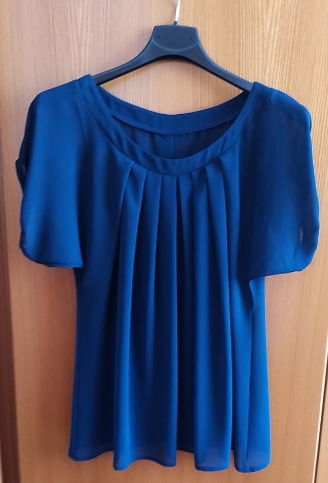Blusa trasparente blu