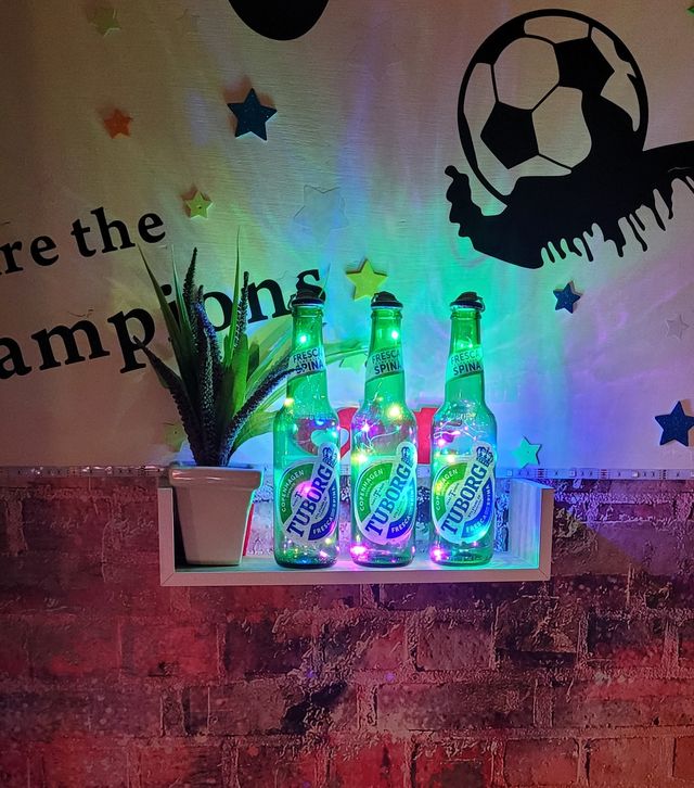 Bottiglie luminose decorative atmosfera