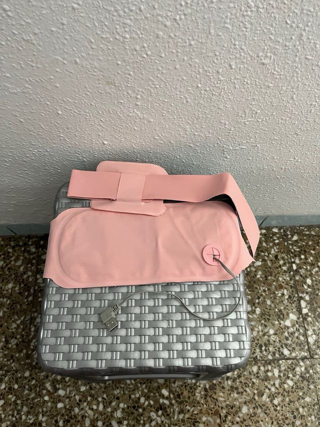 Cinturon rosa para dolores de regla.